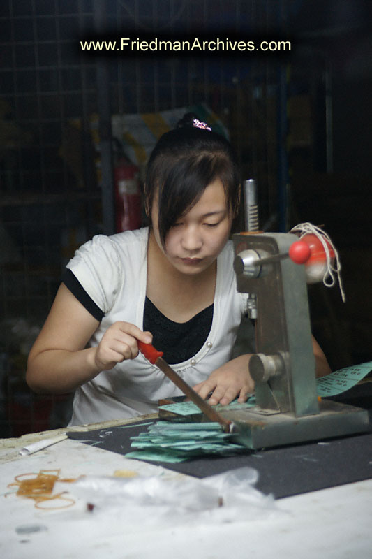 Factory Worker cutting