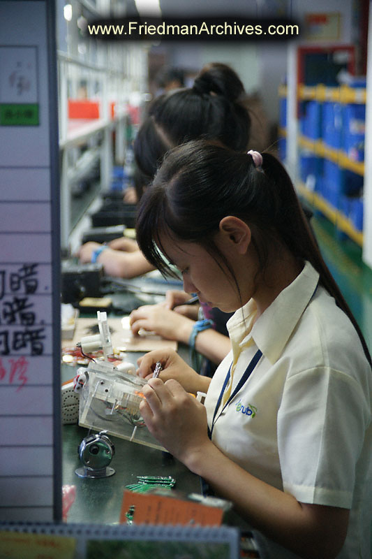 Factory worker electronics assembly line Shenzhen