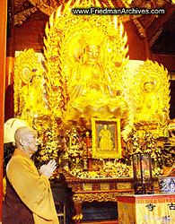 Monk Praying in Temple