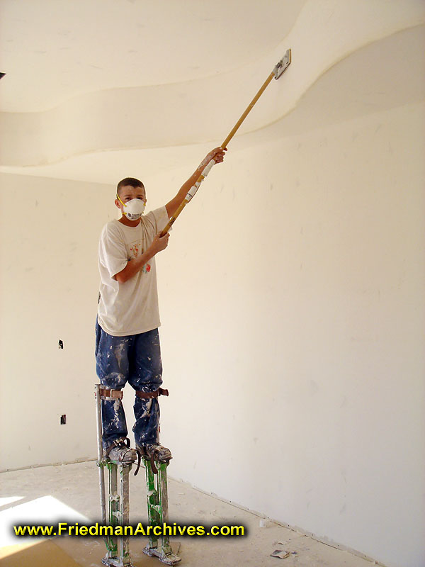 Construction Worker on Stilts