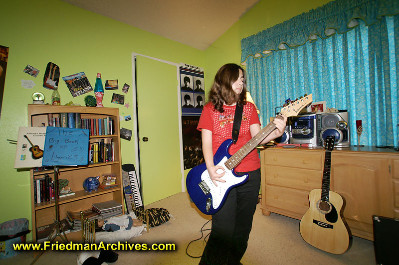 Teenager playing Guitar