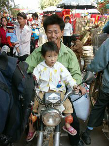Father and Daughter on Motorcycle.