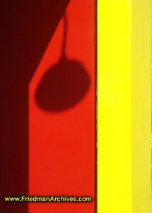 Lamp Shadow on Red and Yellow Wall
