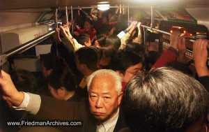 Man on crowded bus