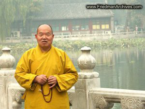 Buddhist Monk and Building